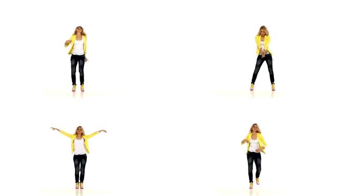 穿着黄色衬衫的年轻金发女孩在白色背景上跳舞性感爵士现代风格，慢动作