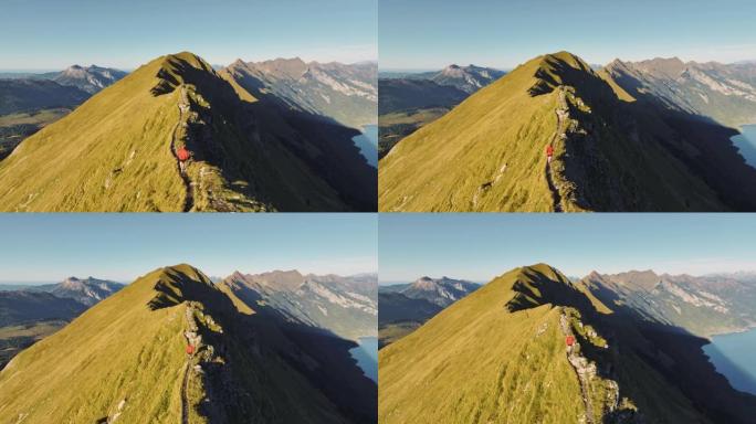 在瑞士阿尔卑斯山的因特拉肯背景下奔跑的人的鸟瞰图
