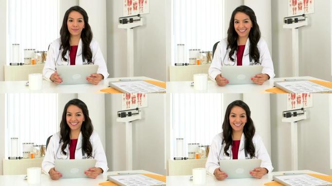 从事平板电脑工作的年轻墨西哥医生