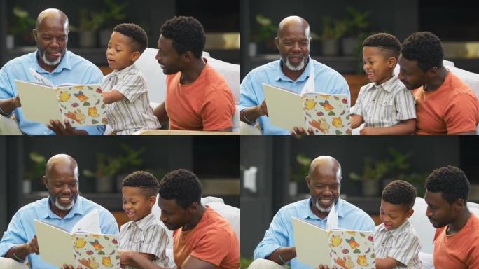 微笑的多代男性家庭一起在花园里读书