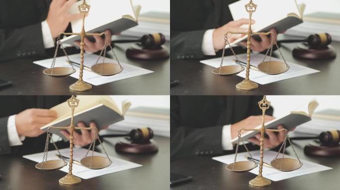 正义与法律概念。法律顾问向客户提交一份与木槌和法律法律或法律背景律师事务所团队会议的签署合同