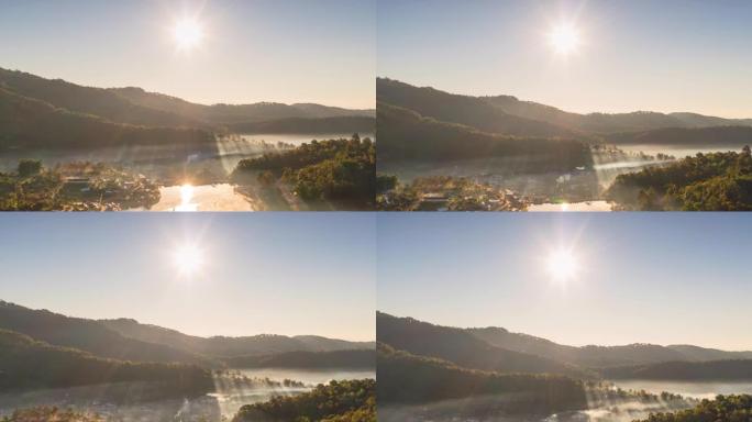 从空中无人机在泰国湄宏顺省班乐泰的雾蒙蒙的早晨天空中观看，泰国班乐泰村的中国村庄，放松旅行。