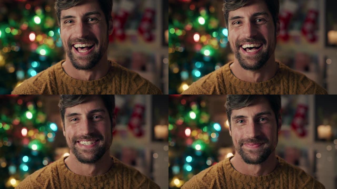肖像迷人的男人笑着在家庆祝圣诞节，享受节日节日4k