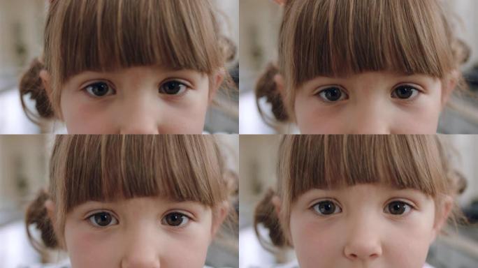 特写肖像美丽的小女孩，表情可爱，看着相机
