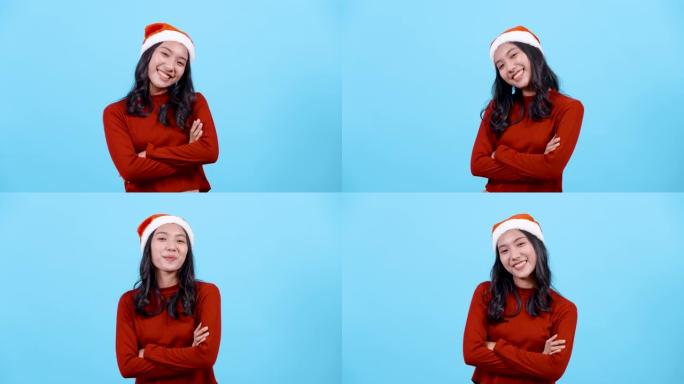 4K，肖像，长发的亚洲女孩红色长袖上衣，戴着圣诞帽，舞蹈将双手放在胸前，快乐的方式，孤立的室内工作室