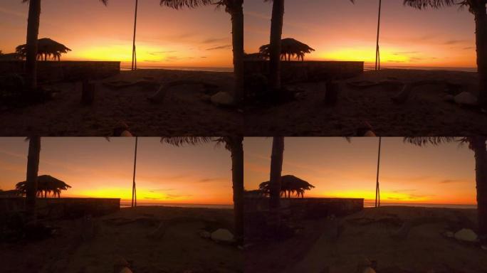 秘鲁北海岸海滩两棵棕榈树之间华丽的金色和橙色日落时间流逝