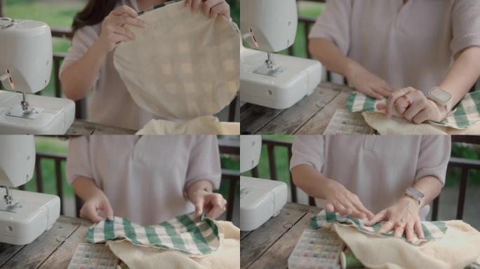 年轻女子准备纺织品缝制自制。