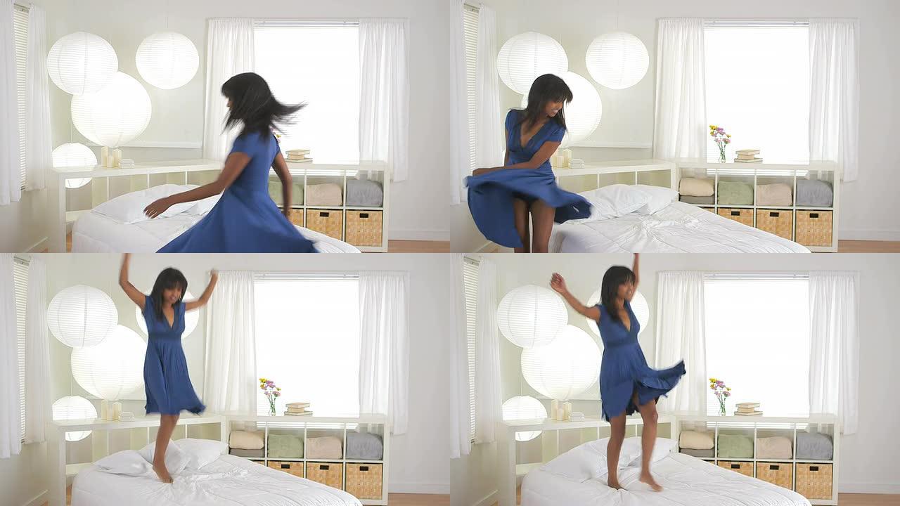 非裔美国女孩在床上跳舞和跳跃