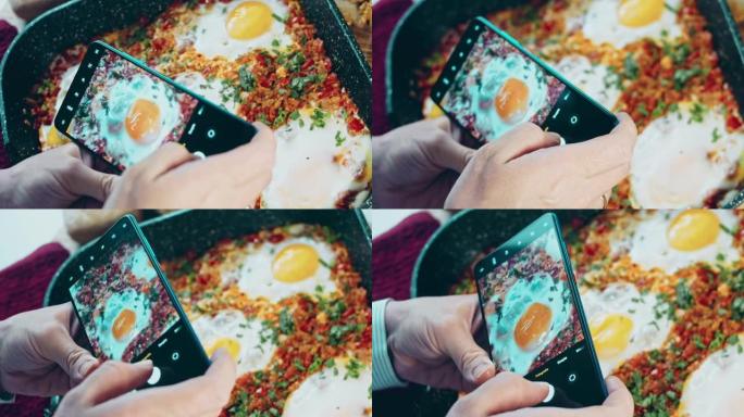 用手机给食物拍照。格鲁吉亚菜煎蛋，chirbuli。鸡蛋西红柿在锅里蒸，蜡烛效果