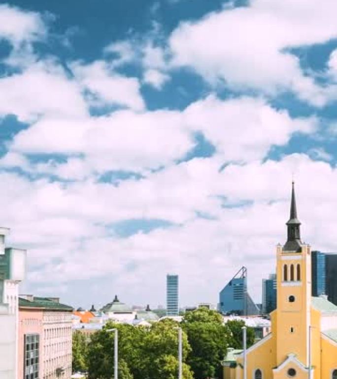 爱沙尼亚塔林。圣约翰·贾尼·基里克教堂在阳光明媚的夏日。垂直镜头视频大型路德教会教区教堂，献给福音传