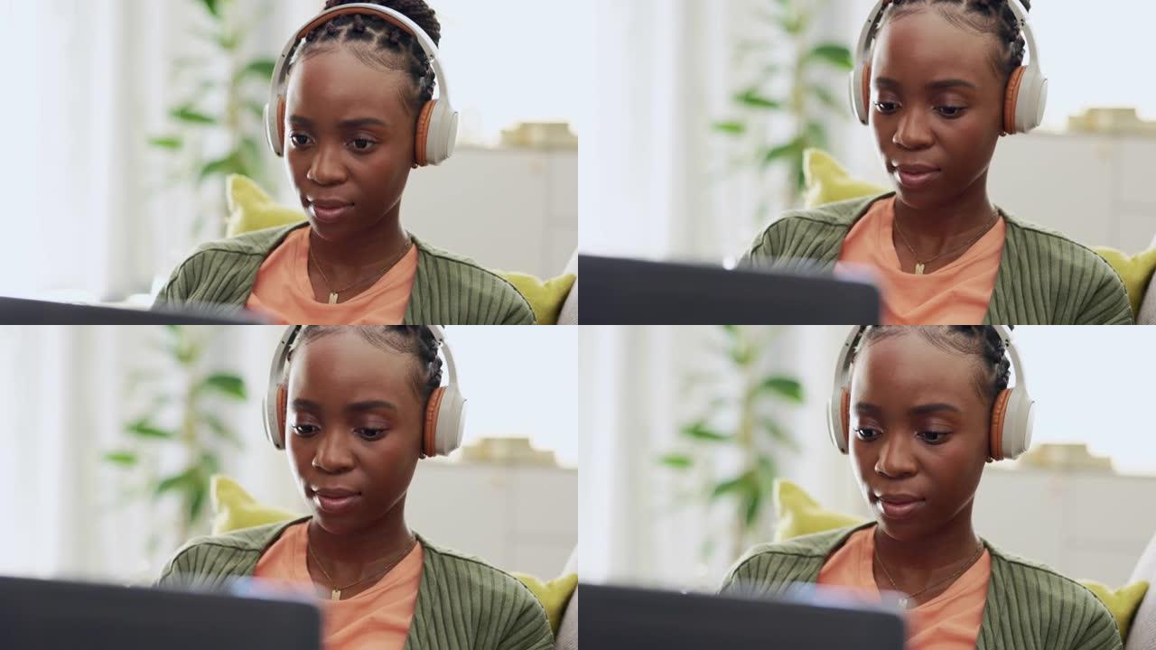 黑人妇女，远程工作和带耳机的笔记本电脑，打字和研究搜索引擎优化项目与网页设计。认真的女性，在家工作时