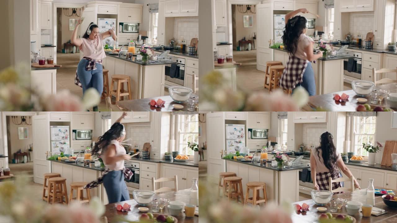 快乐超重的少女在厨房跳舞玩得开心庆祝周末表演有趣的舞蹈动作戴着耳机听音乐