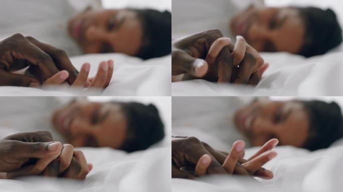 美丽的年轻混血女人躺在床上与男朋友手牵手享受浪漫关系4k