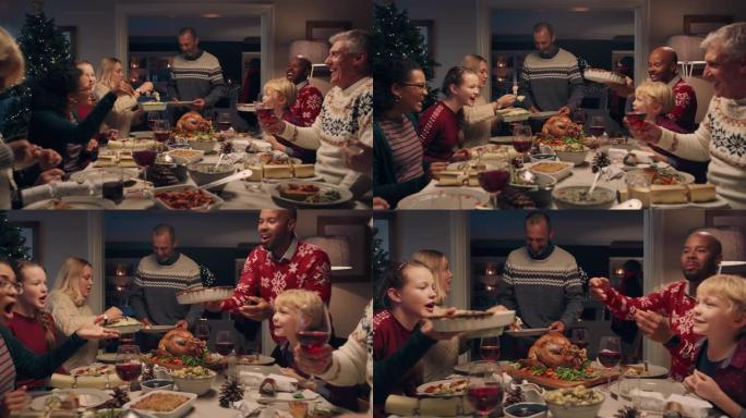 家庭圣诞晚餐男子切火鸡在节日庆祝会上供应美味的饭菜人们坐在餐桌旁享受美味的盛宴在家庆祝节日4k镜头