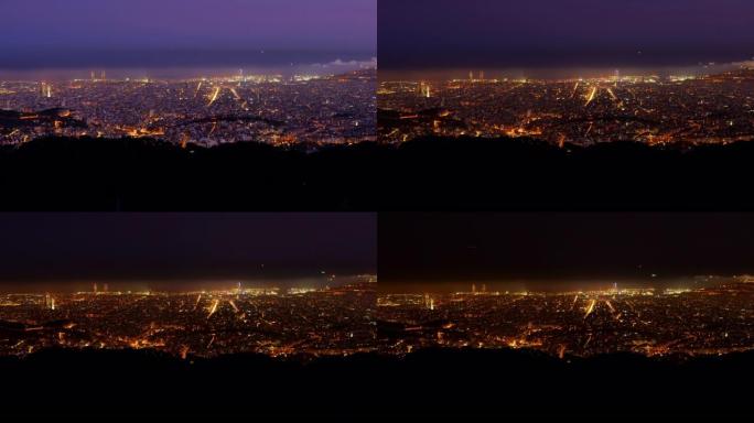 西班牙巴塞罗那灯火通明的市区日转夜万家灯