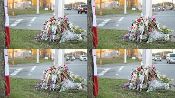 国旗和鲜花标志着警察的死亡