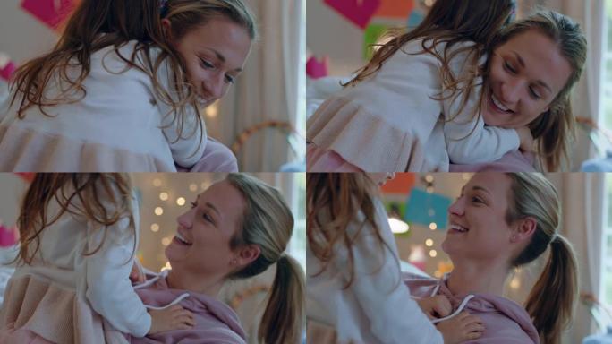 快乐的小女孩拥抱母亲享受慈爱的妈妈在家拥抱女儿4k镜头