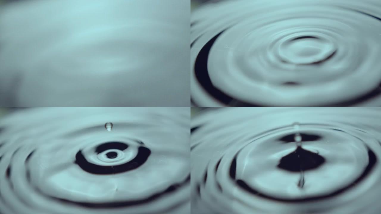 一束水滴快速下落并在水上产生波浪环