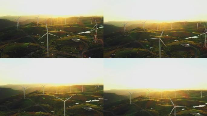 日落时风力涡轮机的鸟瞰图组
