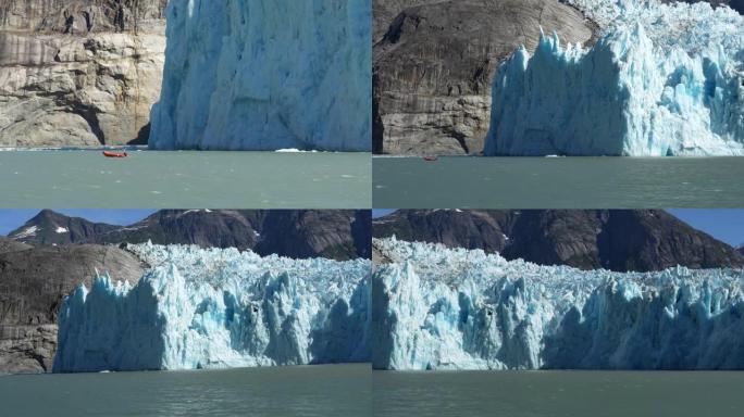 阿拉斯加一条大型tidewater冰川前的小红船