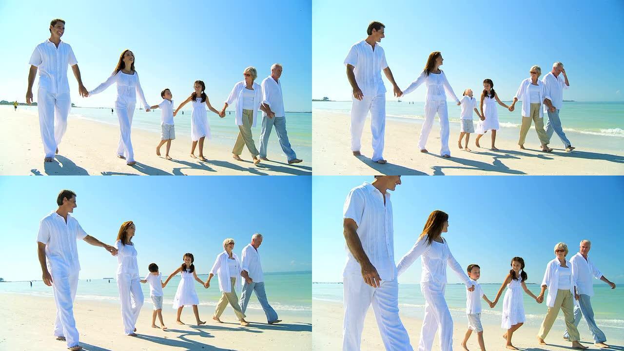 一家三代人在沙滩上散步