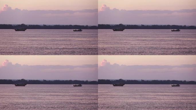 清晨，疏浚船在紫色的天空下泵送河床沙子。