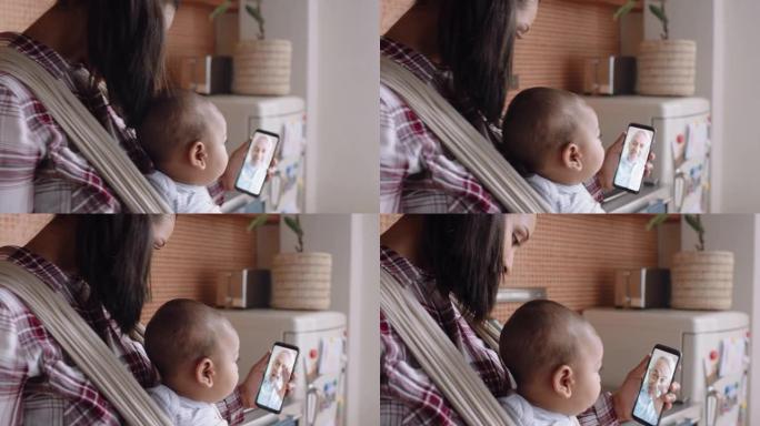 年轻的母亲和婴儿与祖父进行视频聊天，使用智能手机向孙女挥手，享受家庭联系