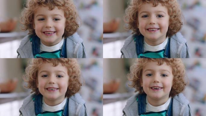 肖像快乐小男孩对着镜头微笑可爱的孩子看起来开朗的表情