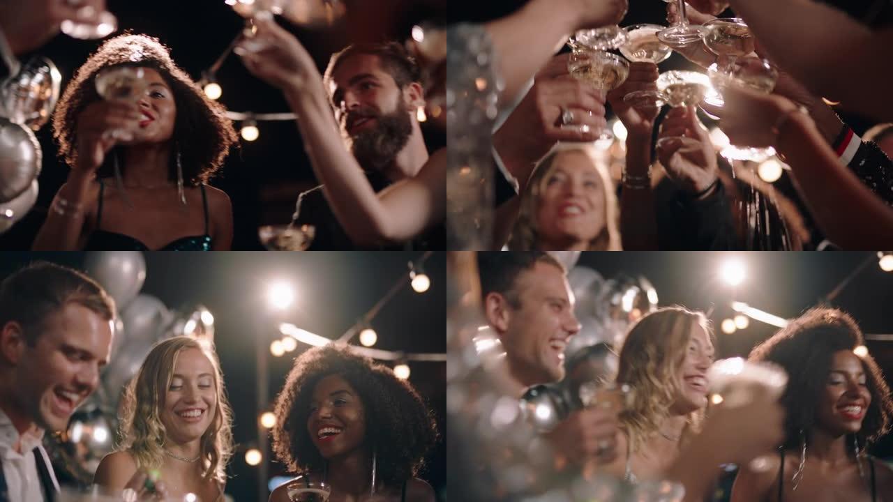 一群时尚的朋友在迷人的屋顶派对活动上庆祝，在正式的社交聚会上喝香槟吐司，享受晚上的庆祝活动4k