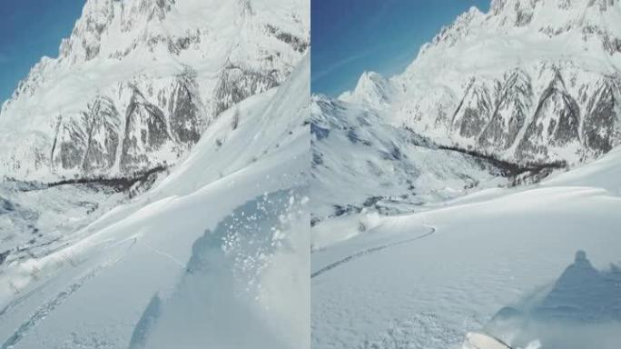 冬季在未触及的偏远山区的新鲜粉末雪上滑雪