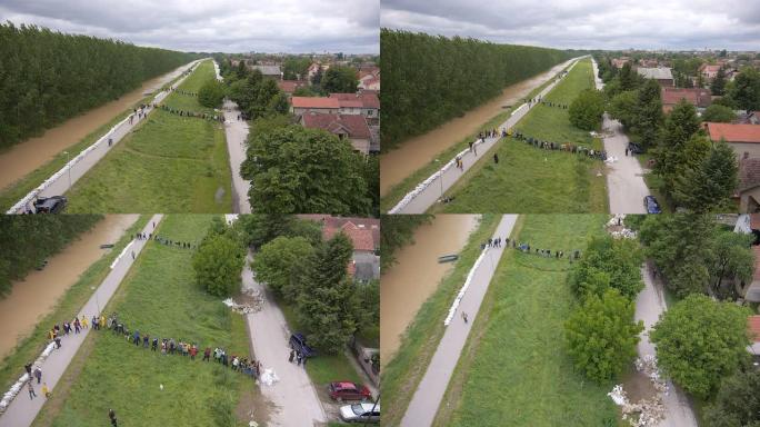 志愿者和士兵装满沙袋以阻止塞尔维亚2014的洪水。