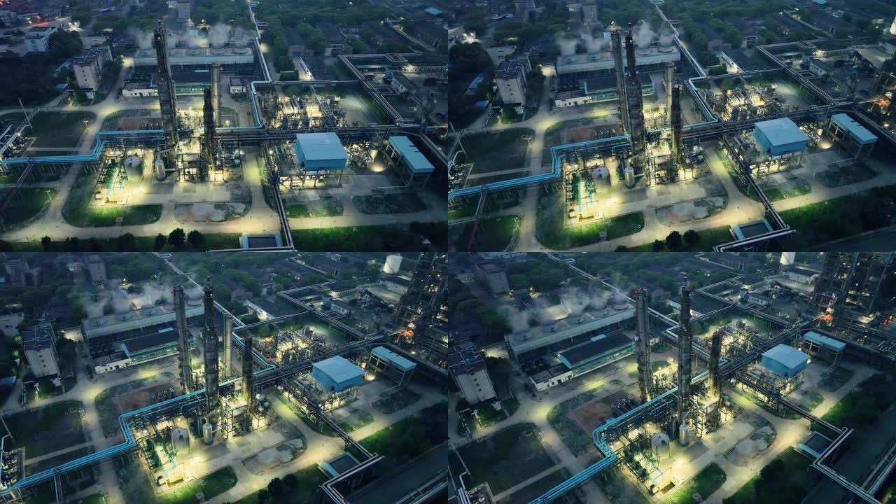 化工精炼厂和建筑材料夜间发光的鸟瞰图