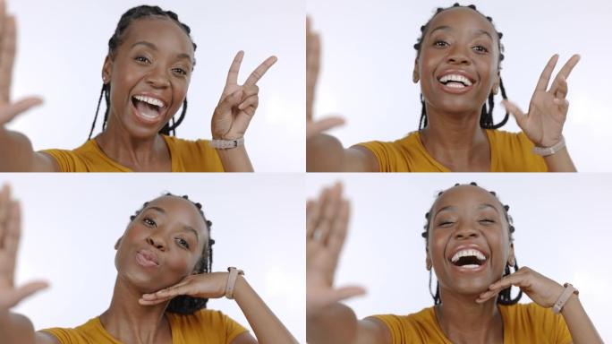 自拍照，微笑和白色背景上带有和平标志的黑人妇女的肖像，以增强自信，快乐和兴奋。工作室、美女脸和女孩用