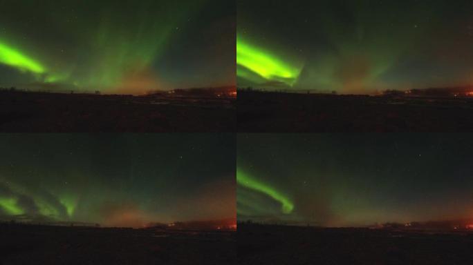 冰岛盖西尔温泉地标上美丽的北极光，喷发