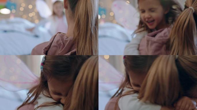 快乐的小女孩拥抱母亲享受慈爱的妈妈在家拥抱女儿4k镜头