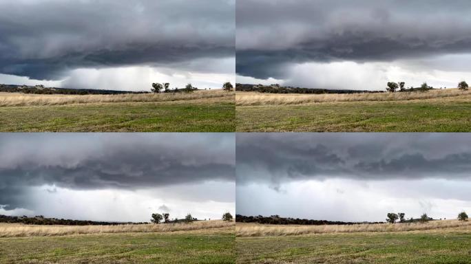 一场危险的暴风雨带着雷声、闪电和乌云向农田逼近的时间推移。