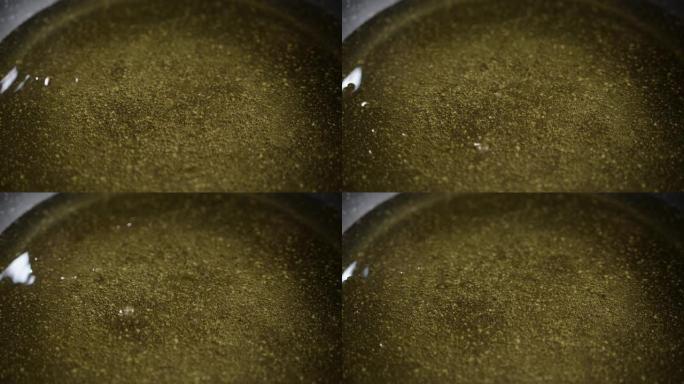 在电感应炉上的热煎锅中煮沸的葵花籽油