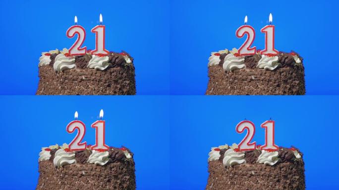 在美味的巧克力蛋糕上吹出21号生日蜡烛，蓝屏