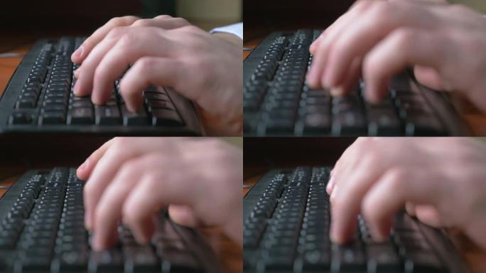 一个年轻人在笔记本电脑键盘上打字的特写镜头