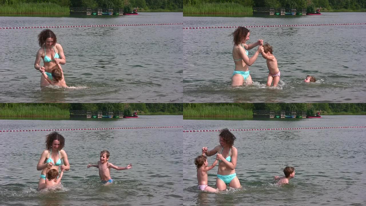 母亲带着小女孩游泳