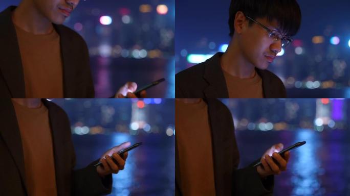 在香港夜城关闭使用智能手机的商人