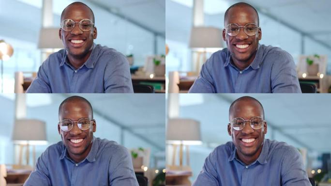 面对一个快乐的黑人在办公室工作，从事计算机反射，从事数字，互联网或在线管理职业。美国商务人士，有工作