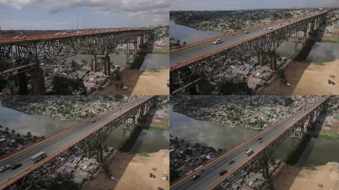 空中拍摄城市贫民窟背景上的桥梁 (多米尼加共和国)