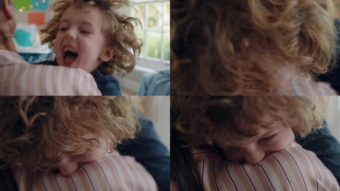 快乐的小男孩拥抱母亲享受慈爱的妈妈在家拥抱儿子4k镜头