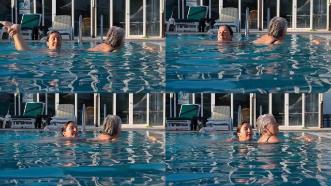 女游泳教练训练水中的老妇人