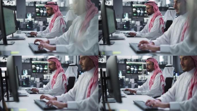 在技术研发机构工作的年轻中东专业人才团队。带有软件代码和技术神经网络图的计算机屏幕