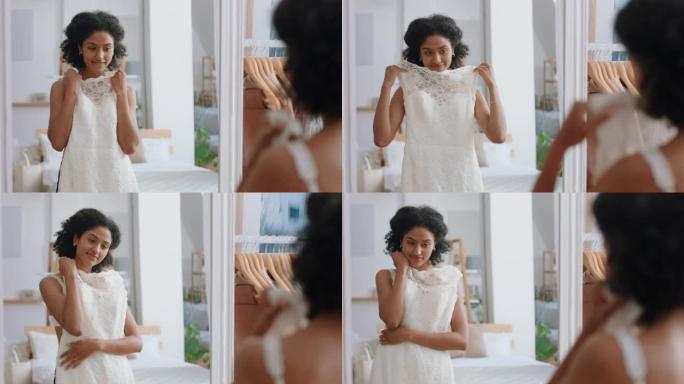 非裔美国妇女新娘穿着婚纱在家里照镜子