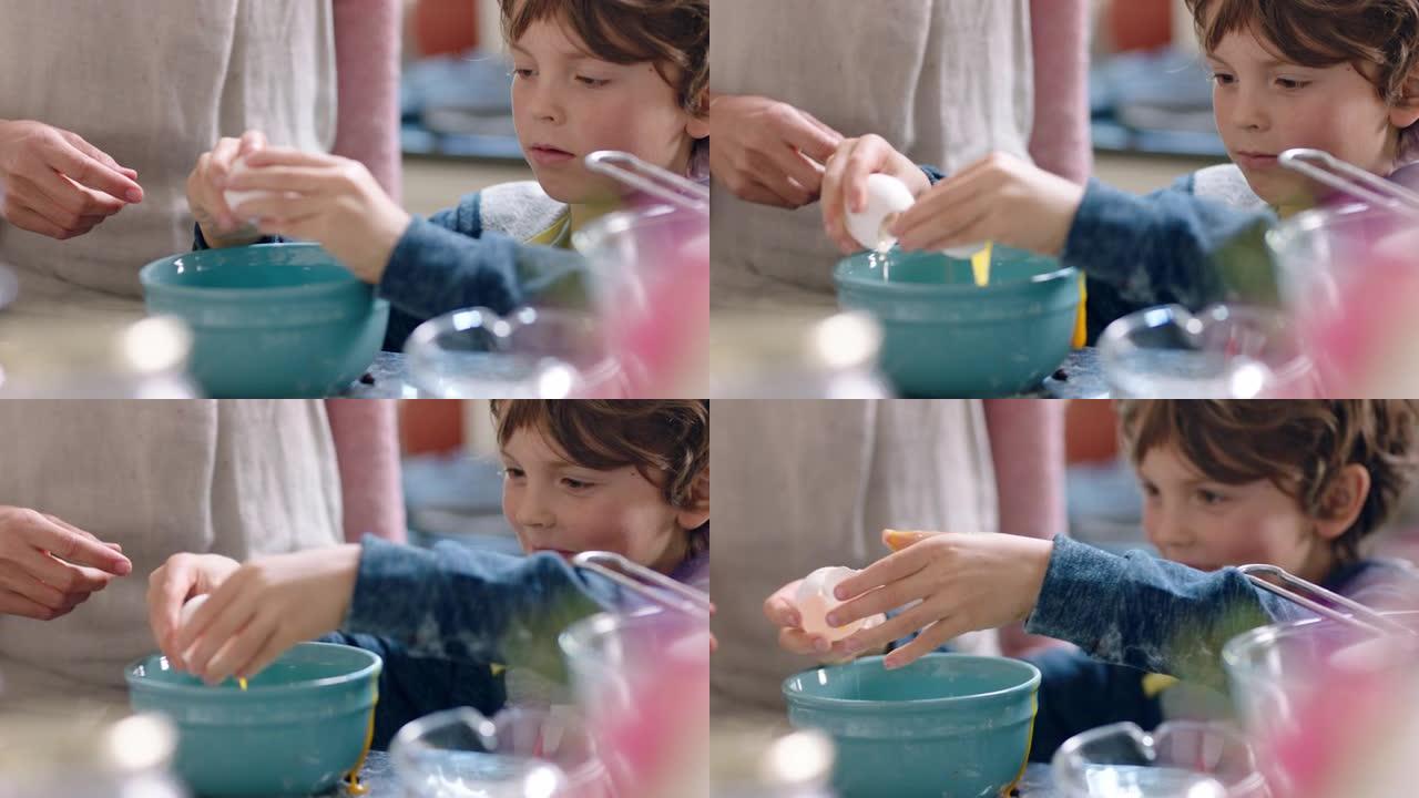 可爱的小男孩帮助妈妈在厨房里烘烤混合配料把鸡蛋打碎成碗里，在家和妈妈一起准备食谱