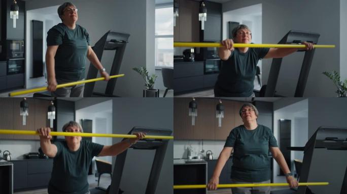 超重高级女子在家训练，手拿健身棒蹲着，保持健康