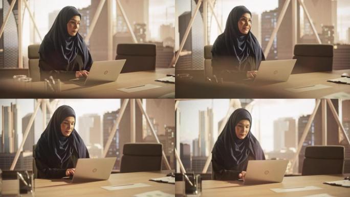 一位年轻的女性企业客户经理在现代公司办公室的笔记本电脑上工作的肖像。处理财务报告的女商人，为公司准备